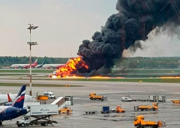 In this image provided by Riccardo Dalla Francesca shows smoke rises from a fire on a plane at Moscow's Sheremetyevo airport on Sunday, May 5, 2019. (Riccardo Dalla Francesca via AP)