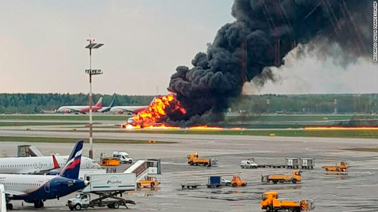 In this image provided by Riccardo Dalla Francesca shows smoke rises from a fire on a plane at Moscow's Sheremetyevo airport on Sunday, May 5, 2019. (Riccardo Dalla Francesca via AP)