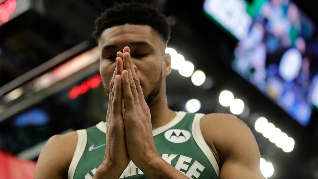 Milwaukee Bucks' Giannis Antetokounmpo pauses before an NBA basketball game against the Detroit Pistons Monday, Jan. 3, 2022, in Milwaukee. (AP Photo/Aaron Gash)