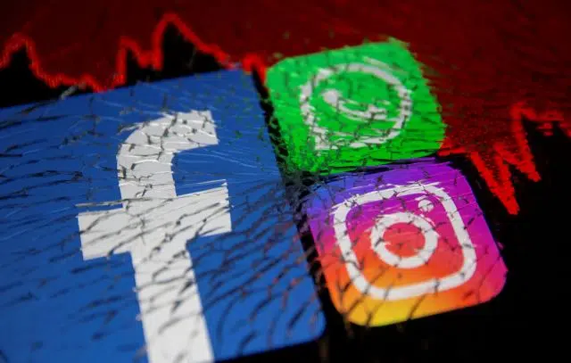 FILE PHOTO: Facebook, Whatsapp and Instagram logos and stock graph are displayed through broken glass in this illustration taken October 4, 2021. REUTERS/Dado Ruvic/Illustration/File Photo