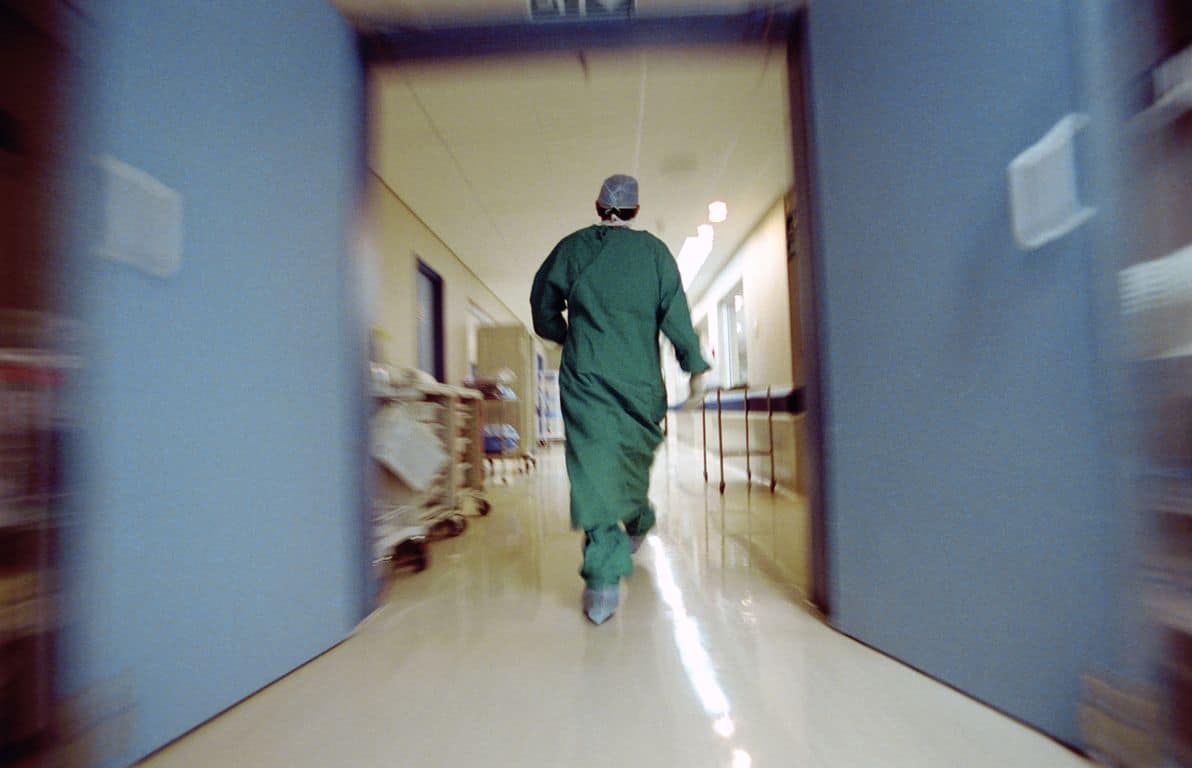 Doctor rushing in hallway