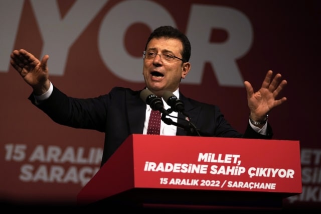 Istanbul Mayor Ekrem Imamoglu speaks to his supporters while they gather in front of the municipal building in Istanbul, Thursday, Dec. 15, 2022. Thousands of people gathered outside the Istanbul municipal building for a second day on Thursday to denounce a legal verdict that could lead to the city's popular mayor being ousted from office and barred from running in elections next year. (AP Photo/Khalil Hamra)