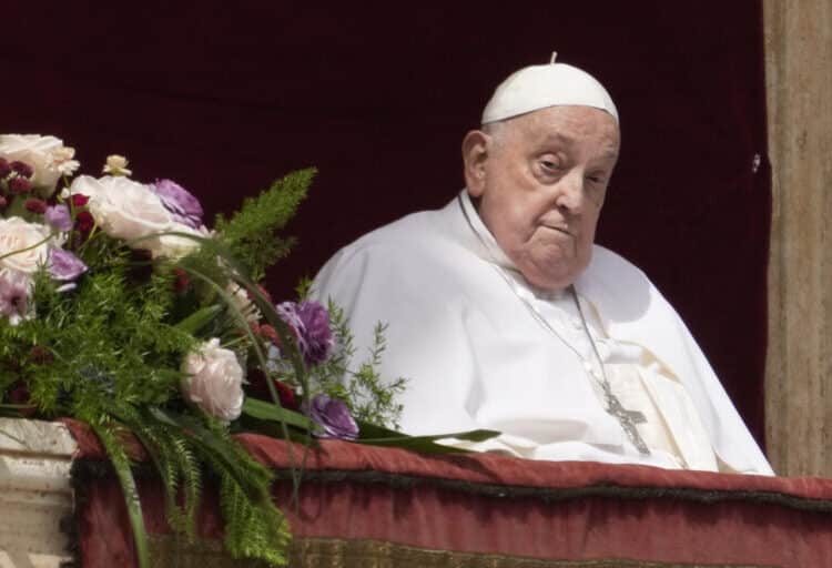 Pope Francis appears on the central lodge of St. Peter's Basilica to bestow the Urbi et Orbi (Latin for to the city and the world) blessing at the end of the Easter mass presided over by Cardinal Angelo Comastri in St. Peter's Square at the Vatican Sunday, April 20, 2025. (AP Photo/Gregorio Borgia)