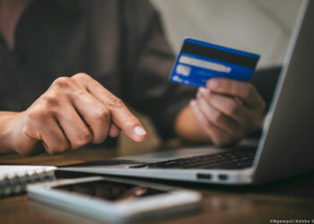 Businessman holding credit card and typing on laptop for online shopping and payment makes a purchase on the Internet, Online payment, Business financial and technology.